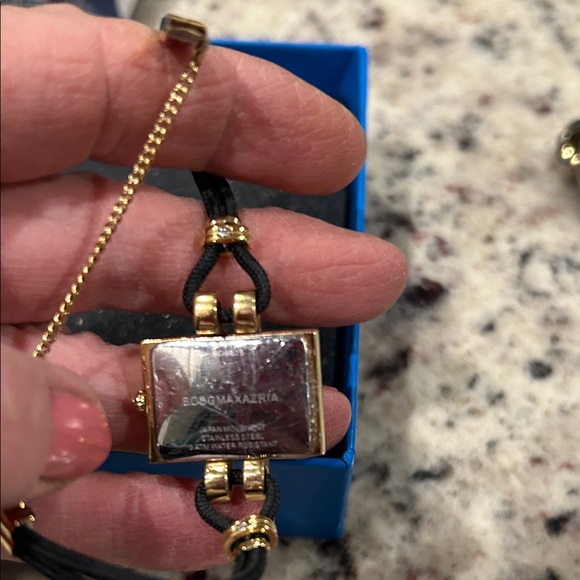 Luxurious Gold and Black Women's Watch with Diamond Accents - Picture 3 of 3